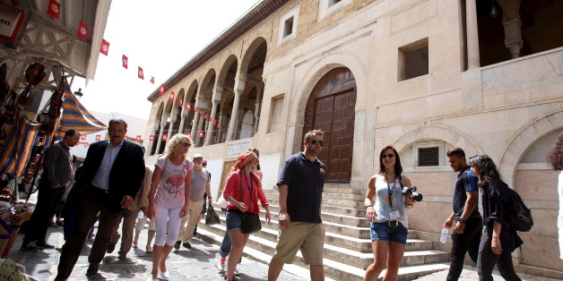 Tourists walk in the Medina, in the old city of Tunis, Tunisia, April 13, 2016. REUTERS/Zoubeir Souissi