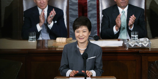 FILE PHOTO: South Korea's President Park Geun-hye is applauded by U.S. Vice President Joe Biden (L) and House Speaker John Boehner (R-OH) as she addresses a joint meeting of Congress in Washington May 8, 2013. REUTERS/Gary Cameron/File Photo