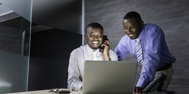 African businessmen working together on an assignment. Cape Town, South Africa.