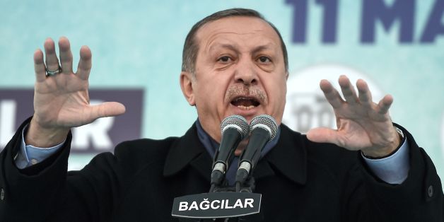 Turkish President Recep Tayyip Erdogan addresses supporters during a rally in Istanbul on March 11, 2017. Erdogan threatened to retaliate after the Netherlands banned the foreign minister from flying in for a campaign rally, as he said The Hague's behaviour was reminiscent of Nazism. Turkish politicians are keen to harness votes of the Turkish community in Europe ahead of the April 16 referendum on whether to boost Erdogan's powers. / AFP PHOTO / OZAN KOSE (Photo credit should read OZAN K
