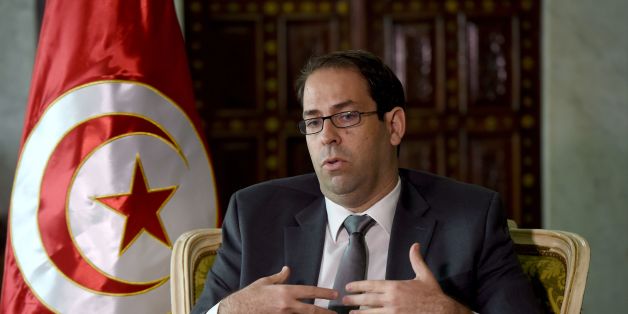Tunisian Prime Minister Youssef Chahed speaks with AFP journalists on November 8, 2016 in Tunis.
The Tunisian prime minister heads to Paris on November 9 in a bid to drum up French investment in the struggling economy of its former North African colony. Chahed, 41, will meet his counterpart Manuel Valls and President Francois Hollande during the 'strategic' visit. / AFP / FETHI BELAID (Photo credit should read FETHI BELAID/AFP/Getty Images)