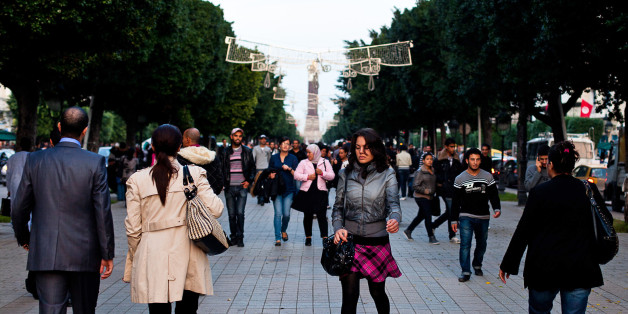 Pedestrians walk along Avenue Bourguiba in Tunis, Tunisia, on Wednesday, Nov. 2, 2011. Tunisia's government expects economic growth to accelerate to 4.5 percent next year, the state-run Agence Tunis Afrique Presse reported, citing the draft budget. Photographer: Trevor Snapp/Bloomberg via Getty Images