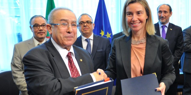 BRUSSELS, BELGIUM - JUNE 04: Algerian Foreign Minister Ramtane Lamamra (L) and High Representative of the European Union for Foreign Affairs and Security Policy, Federica Mogherini (R) shake hands after signing a bilateral agreement following the Algeria-EU Association Council Meeting in Brussels, Belgium on June 4, 2015. (Photo by Dursun Aydemir/Anadolu Agency/Getty Images)