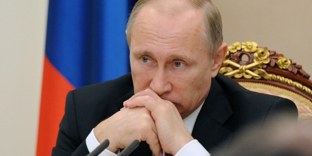 Russian President Vladimir Putin chairs a meeting with the government at the Kremlin in Moscow on March 25, 2015. AFP PHOTO / RIA NOVOSTI / MIKHAIL KLIMENTYEV (Photo credit should read MIKHAIL KLIMENTYEV/AFP/Getty Images)