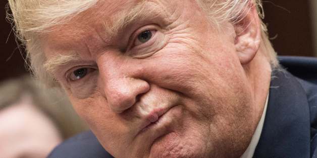 US President Donald Trump attends a meeting about healthcare in the Roosevelt Room at the White House in Washington, DC, on March 13, 2017. / AFP PHOTO / NICHOLAS KAMM (Photo credit should read NICHOLAS KAMM/AFP/Getty Images)