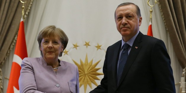 ANKARA, TURKEY - FEBRUARY 2 : Turkish President Recep Tayyip Erdogan (R) and German Chancellor Angela Merkel (L) shake hands during a press conference after their meeting at the Presidential Complex in Ankara, Turkey on February 2, 2017. (Photo by Halil Sarkaya/Anadolu Agency/Getty Images)