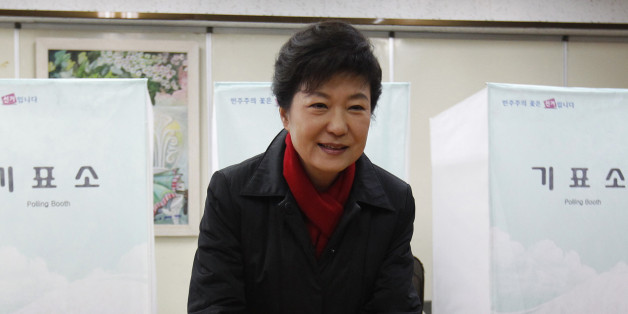 South Korea's presidential candidate Park Geun-hye of conservative and right wing ruling Saenuri Party casts her ballot at a polling station in Seoul December 19, 2012. South Koreans vote for a new president on Wednesday against a backdrop of a hostile North Korea and a slowing economy, in a battle between conservative candidate Park, 60, daughter of former military ruler Park Chung-hee and Moon Jae-in of the Democratic United Party, who was jailed by her father decades ago for political activis