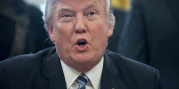 US President Donald Trump speaks before signing an executive order entitled Comprehensive Plan for Reorganizing the Executive Branch in the Oval Office at the White House in Washington, DC, on March 13, 2017. / AFP PHOTO / NICHOLAS KAMM (Photo credit should read NICHOLAS KAMM/AFP/Getty Images)