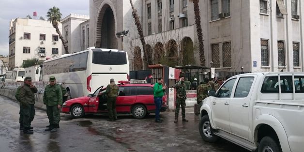 Syrian security forces cordon off the area following a reported suicide bombing at the old palace of justice building in Damascus on March 15, 2017.A suicide bomber attacked the courthouse in the centre of the Syrian capital, killing at least 25 people and wounding others, state media reported. / AFP PHOTO / STRINGER (Photo credit should read STRINGER/AFP/Getty Images)