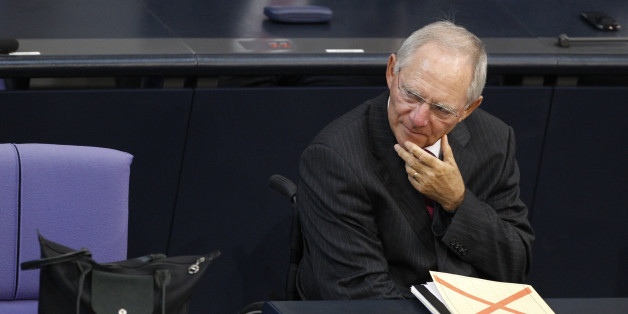 German Finance Minister Wolfgang Schaeuble attends a session of the Bundestag, the lower house of parliament, before a vote on a Spanish bank aid package in Berlin, July 19, 2012. Chancellor Angela Merkel's authority within her centre-right coalition was at stake on Thursday when uneasy German lawmakers vote on Berlin's contribution to a euro zone aid package for Spain's ailing banks. REUTERS/Thomas Peter (GERMANY - Tags: POLITICS BUSINESS)