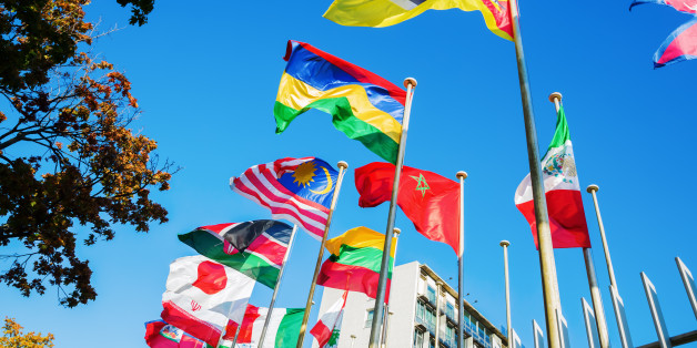 world flags in front of UNESCO headquarters in Paris, France