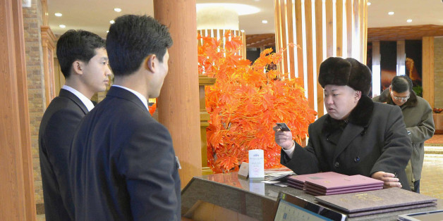 North Korean leader Kim Jong Un (C) visits the newly built ski resort in the Masik Pass region, in this undated photo released by North Korea's Korean Central News Agency (KCNA) in Pyongyang on December 31, 2013. North Korea's state-run television KRT said Kim was satisfied with the ski resort after looking around its facilities which included a hotel, ski service and rental shops. REUTERS/KCNA (NORTH KOREA - Tags: POLITICS SOCIETY) ATTENTION EDITORS - THIS PICTURE WAS PROVIDED BY A THIRD PA