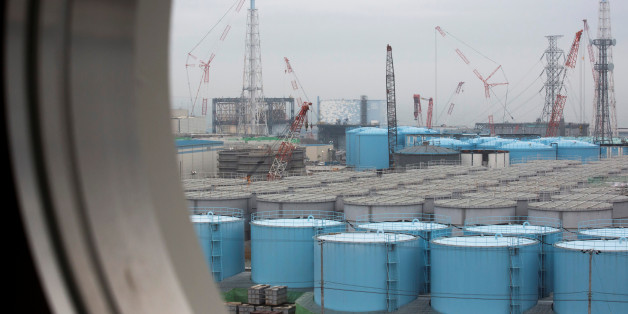 Storage tanks for contaminated water are seen through a window of a building at Tokyo Electric Power Co.'s (TEPCO) Fukushima Daiichi nuclear power plant in Okuma, Fukushima, Japan, February 23, 2017. REUTERS/Tomohiro Ohsumi/Pool