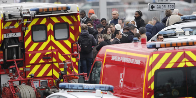 Repeating correcting date - Passengers wait amongst emergency vehicles at Orly airport southern terminal after a shooting incident near Paris, France March 18, 2017. REUTERS/Benoit Tessier