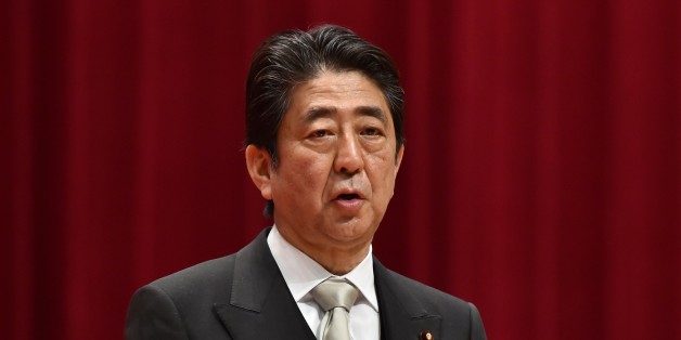 Japanese Prime Minister Shinzo Abe delivers a speech during the graduation ceremony of the National Defense Academy in Yokosuka, Kanagawa prefecture on March 19, 2017. / AFP PHOTO / KAZUHIRO NOGI (Photo credit should read KAZUHIRO NOGI/AFP/Getty Images)