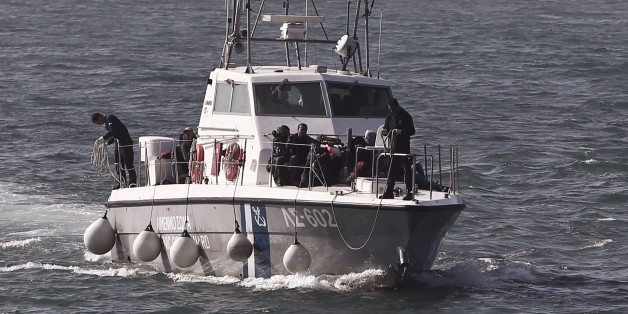 Shipwreck immigrants sit on the ship of Hellenic coast guard as they arrive in the port of Lesvos island on April 17, 2015. Since Greece bolstered controls along its land border with Turkey, along the Evros River, illegal immigrants have turned to the maritime route between Turkey and the Greek islands in the Aegean Sea, notably Lesvos, Samos, Kos and Chios. 2015 started with a major increase in the number of Aegean crossings : 10,445 against 2,863 in the same period of 2014, according to the Greek port police. AFP PHOTO / ANGELOS TZORTZINIS (Photo credit should read ANGELOS TZORTZINIS/AFP/Getty Images)