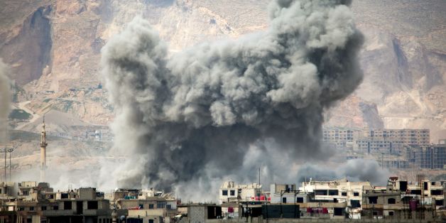 Smoke billows following a reported air strike in the rebel-held parts of the Jobar district, on the eastern outskirts of the Syrian capital Damascus, on March 20, 2017. / AFP PHOTO / AMER ALMOHIBANY (Photo credit should read AMER ALMOHIBANY/AFP/Getty Images)