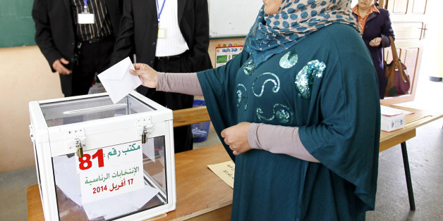 ALGIERS, ALGERIA - APRIl 17: An Algerian woman casts her ballot for Algeria's presidential election at a polling station in Algiers, Algeria on April 17, 2014. Voting started Thursday in Algeria's presidential election, amid expectations that incumbent President Abdelaziz Bouteflika will win re-election. Six candidates, including Bouteflika, are contesting the Arab-African country's most coveted post. (Photo by Bechir Ramzy/Anadolu Agency/Getty Images)