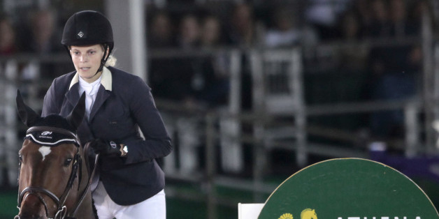 Athina Onassis rides her horse Ad Welcome Du Petit Vivier during the Athina Onassis International Horse Show in Rio de Janeiro September 2, 2011. Athina Onassis is a competitive show jumper and the only surviving descendant of her grandfather Aristotle Onassis, the Greek shipping magnate. REUTERS/Ricardo Moraes (BRAZIL - Tags: SPORT HORSE RACING PROFILE EQUESTRIANISM)