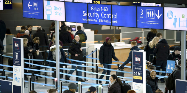 Passengers enter the security control area at the Helsinki airport in Vantaa, Finland March 10, 2017. Lehtikuva/Antti Aimo-Koivisto/via REUTERS ATTENTION EDITORS - THIS IMAGE WAS PROVIDED BY A THIRD PARTY. FOR EDITORIAL USE ONLY. NO THIRD PARTY SALES.FINLAND OUT. NO COMMERCIAL OR EDITORIAL SALES IN FINLAND