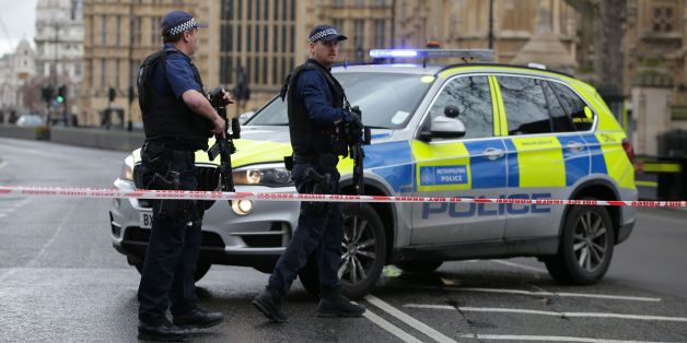 Armed police officers guard at a police cordon outside the Houses of Parliament in central London on March 22, 2017 during an emergency incident. / AFP PHOTO / Daniel LEAL-OLIVAS (Photo credit should read DANIEL LEAL-OLIVAS/AFP/Getty Images)