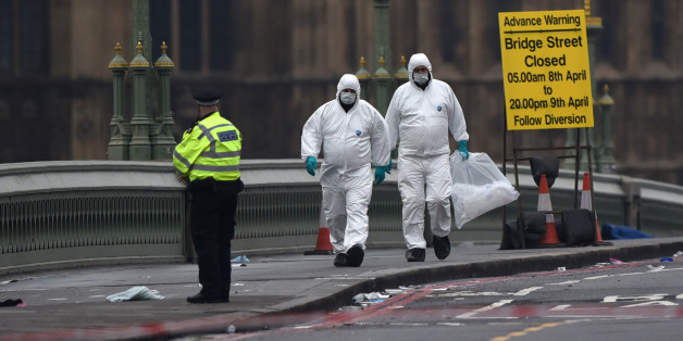 LONDON, ENGLAND - MARCH 23: Police forensic officers work on Westminster Bridge following yesterday's attack, on March 23, 2017 in London, England. Four people have been killed and around 40 people injured following yesterday's attack by the Houses of Parliament in Westminster. (Photo by Carl Court/Getty Images)