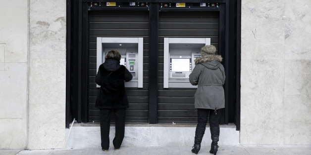 Customers withdraw cash from automated teller machines (ATM) operated by the National Bank of Greece SA in Thessaloniki, Greece, on Thursday, Dec. 1, 2016. Greek markets have rallied this month on expectations creditors may finally ease the countrys debt at a Dec. 5 meeting of euro-area finance ministers. Photographer: Konstantinos Tsakalidis/Bloomberg via Getty Images