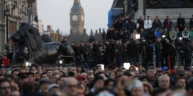 People gather for a vigil in Trafalgar Square in central London on March 23, 2017 in solidarity with the victims of the March 22 terror attack at the British parliament and on Westminster Bridge.
Britain's parliament reopened on Thursday with a minute's silence in a gesture of defiance a day after an attacker sowed terror in the heart of Westminster, killing three people before being shot dead. Sombre-looking lawmakers in a packed House of Commons chamber bowed their heads and police officers also marked the silence standing outside the headquarters of London's Metropolitan Police nearby.
/ AFP PHOTO / Adrian DENNIS (Photo credit should read ADRIAN DENNIS/AFP/Getty Images)