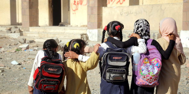 Yemeni school girls walk outside a school on March 16, 2017, that was damaged in an air strike in the southern Yemeni city of Taez.The conflict in Yemen, which escalated with the intervention of the Saudi-led coalition two years ago, has more than doubled the number of children deprived of schooling to some 3.5 million, threatening the future of a whole generation in the impoverished country. / AFP PHOTO / Ahmad AL-BASHA (Photo credit should read AHMAD AL-BASHA/AFP/Getty Images)