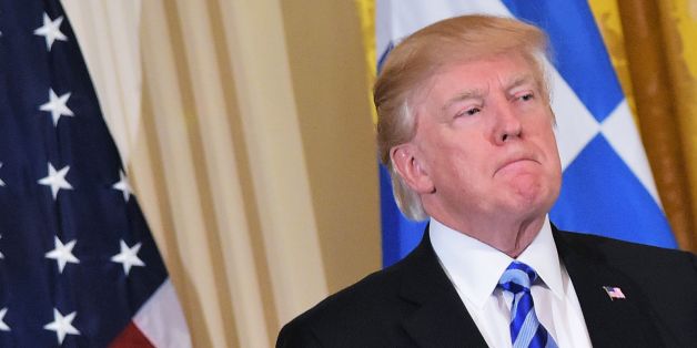US President Donald Trump listens to a speaker during a Greek Independence Day celebration in the East Room of the White House on March 24, 2017 in Washington, DC. / AFP PHOTO / MANDEL NGAN (Photo credit should read MANDEL NGAN/AFP/Getty Images)