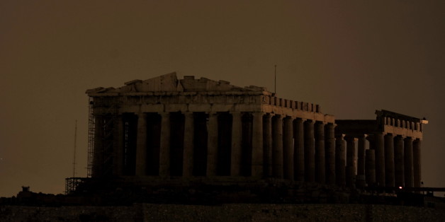 The ancient Parthenon Temple on top of the Acropolis hill is not floodlit as Greece participate in Earth Hour in Athens on March 27, 2010. More than 120 countries participate in turning off lights for 60 minutes from 8:30 to 9:30 in the evening local time in an effort to raise global awareness on climate change. AFP PHOTO / Aris Messinis (Photo credit should read ARIS MESSINIS/AFP/Getty Images)