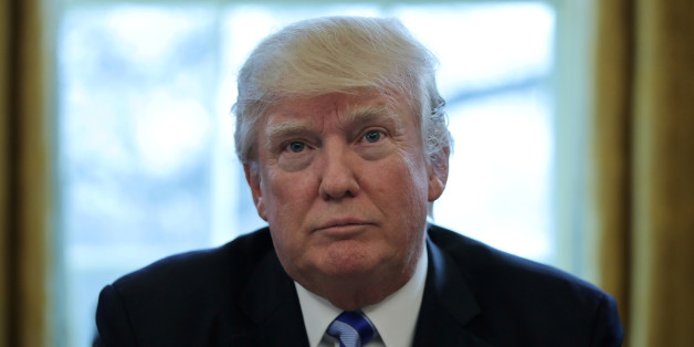 U.S. President Donald Trump talks to journalists at the Oval Office of the White House after the AHCA health care bill was pulled before a vote in Washington, U.S. March 24, 2017. REUTERS/Carlos Barria