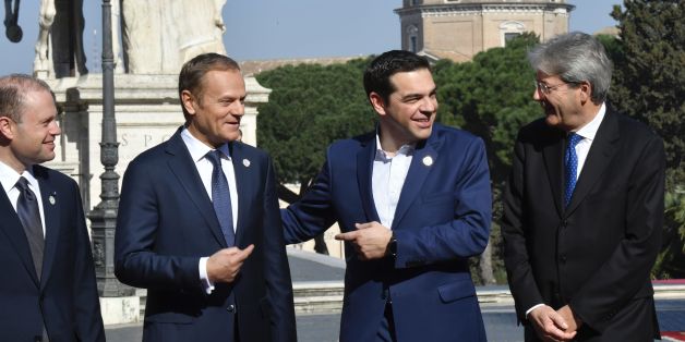Greece's Prime Minister Alexis Tsipras (2-R) reacts, as Malta's Prime minister Joseph Muscat (L), European Council President Donald Tusk (2-L), and Italy's Prime Minister Paolo Gentiloni look on ahead of a special summit of EU leaders to mark the 60th anniversary of the bloc's founding Treaty of Rome, on March 25, 2017 at Rome's Piazza del Campidoglio (Capitoline Hill).
Meeting in the same Renaissance-era palace where six founding countries signed the Treaty of Rome on March 25, 1957, the 27 leaders minus Britain will endorse a declaration of intent for the next decade. / AFP PHOTO / Andreas SOLARO (Photo credit should read ANDREAS SOLARO/AFP/Getty Images)