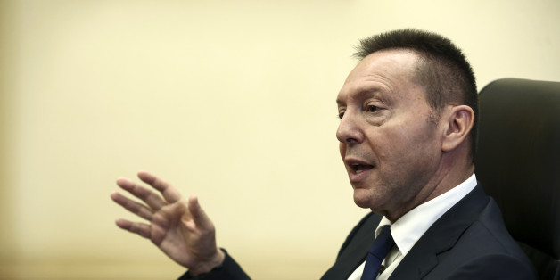 Yannis Stournaras, governor of the Bank of Greece, gestures as he speaks during an interview at the bank's headquarters in Athens, Greece, on Friday, Nov. 25, 2016. It's 'far too early' to talk about winding down European Central Bank bond purchases, Stournaras said. Photographer: Yorgos Karahalis /Bloomberg via Getty Images
