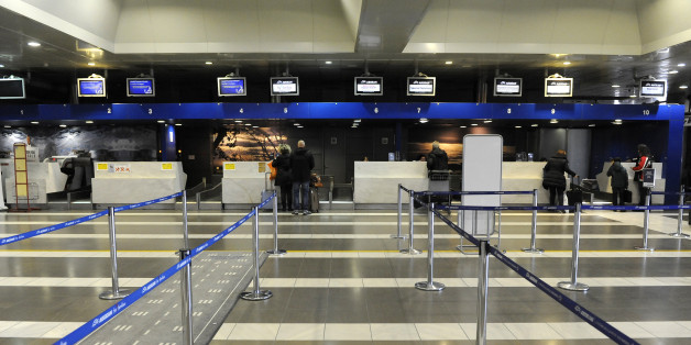 Passengers are seen at the check-in area of the airport included in a big privatisation deal between Greece and German airport operator Fraport, Thessaloniki, Greece December 14, 2015. Greece's leftist government on Monday signed its first big privatisation deal with Fraport, awarding it a 1.2 billion euro ($1.32 billion) contract to lease and manage 14 regional airports. REUTERS/Alexandros Avramidis