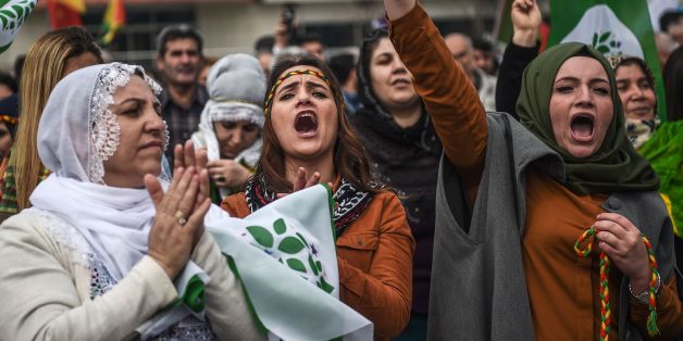 TOPSHOT - Women flash the victory sign during the Newroz celebrations for the new year on March 21, 2017 in Istanbul.
Newroz (also known as Nawroz or Nowruz) is an ancient Persian festival, which is also celebrated by Kurdish people, marking the first day of spring, which falls on March 21. / AFP PHOTO / OZAN KOSE (Photo credit should read OZAN KOSE/AFP/Getty Images)