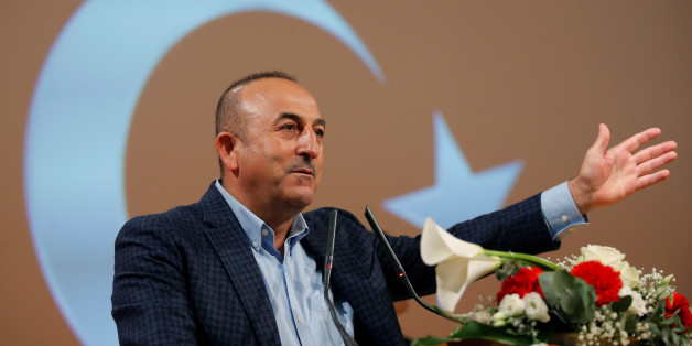 Turkish Foreign Minister Mevlut Cavusoglu addresses supporters during a political rally on Turkey's upcoming referendum, in Metz, France, March 12, 2017. REUTERS/Vincent Kessler TPX IMAGES OF THE DAY