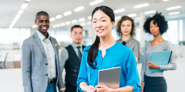 Japanese business woman manager of a multiracial business team