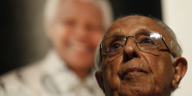 Anti-apartheid activist and close friend of former South African President Nelson Mandela, Ahmed Kathrada, talks during a tribute to Mandela at Gandhi Hall, on December 8, 2013 in Johannesburg. The revered icon of the anti-apartheid struggle in South Africa and one of the towering political figures of the 20th century, died in Johannesburg on December 5 at age 95. Mandela, who was elected South Africa's first black president after spending nearly three decades in prison, had been receiving treat