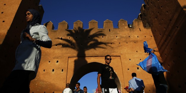 People walk through Bab el Had gates of Rabat's Medina September 21, 2014. UNESCO made Rabat a World Heritage Site two years ago and media and tour operators call it a "must-see destination." But it seems the tourist hordes have yet to find out. While visitors are getting squeezed through the better-known sites of Marrakesh and Fez, the old part of Rabat - with its beautiful Medina and Kasbah of the Udayas - remains an almost unspoiled oasis of calm. Smaller and more compact, its labyrinths of streets, passages and dead ends are a treasure trove of shapes and colours, of moments begging to be caught by the photographer's lens. Picture taken September 21, 2014. REUTERS/Damir Sagolj (MOROCCO - Tags: SOCIETY TPX IMAGES OF THE DAY TRAVEL)
ATTENTION EDITORS: PICTURE 03 OF 24 FOR WIDER IMAGE PACKAGE 'RABAT'S TREASURE TROVE OF COLOURS'
TO FIND ALL IMAGES SEARCH 'RABAT DAMIR'