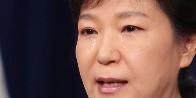 SEOUL, SOUTH KOREA - MAY 19: In this handout image provided by the South Korean Presidential Blue House, South Korean President Park Geun-Hye weeps during an address to the nation about the sunken ferry Sewol at the presidential Blue House on May 19, 2014 in Seoul, South Korea. (Photo by South Korean Presidential Blue House via Getty Images)