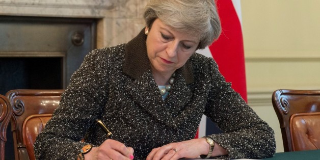 LONDON, UNITED KINGDOM - MARCH 28: : (----EDITORIAL USE ONLY MANDATORY CREDIT - PRIME MINISTRY OF THE UNITED KINGDOM / HANDOUT ' - NO MARKETING NO ADVERTISING CAMPAIGNS - DISTRIBUTED AS A SERVICE TO CLIENTS----) British Prime Minister Theresa May signs the official letter to European Council President Donald Tusk invoking Article 50 and the United Kingdom's intention to leave the EU on March 28, 2017 in London, England. After holding a referendum in June 2016 the United Kingdom voted to leave the European Union. (Photo by PRIME MINISTRY OF THE UNITED KINGDOM / HANDOUT /Anadolu Agency/Getty Images)