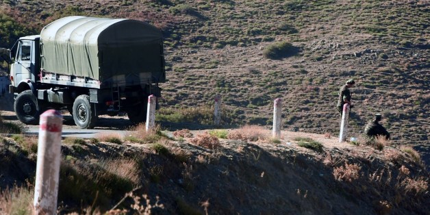 Algerian troops carry out search operations in the mountainous eastern Tizi Ouzou region in a desperate bid to find French hiker Herve Gourdel who was kidnapped by militants linked to the Islamic State group who have threatened to execute him on September 23, 2014 near the village of Ait Ouaban, 80 km south of Tizi Ouzou. Paris vowed it would not negotiate with jihadists, as the local army raced against time to find him before his threatened execution. AFP PHOTO / FAROUK BATICHE (Photo