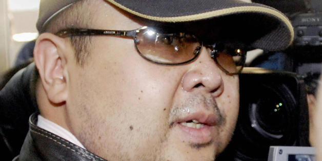 Beijing, CHINA: A man believed to be North Korean leader Kim Jong-Il's eldest son, Kim Jong-Nam, is surrounded by journalists upon his arrival at Beijing's capital airport, 11 February 2007. Wearing a cap, sunglasses and jeans, the man who Japanese television crew described as Kim Jong-Nam arrived at Beijing's airport from Macau in the afternoon, as six-nation talks on ending North Korea's nuclear weapons programme were underway in the Chinese capital. Kim Jong-Nam, 35, was recently reported to
