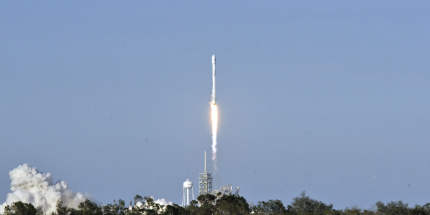 SpaceX's Falcon 9 rocket lifts off from space launch complex 39A at Kennedy Space Center, Florida on March 30, 2017, with an SES communications satellite. SpaceX blasted off a recycled rocket for the first time on, using a booster that had previously flown cargo to the astronauts living at the International Space Station. / AFP PHOTO / BRUCE WEAVER (Photo credit should read BRUCE WEAVER/AFP/Getty Images)
