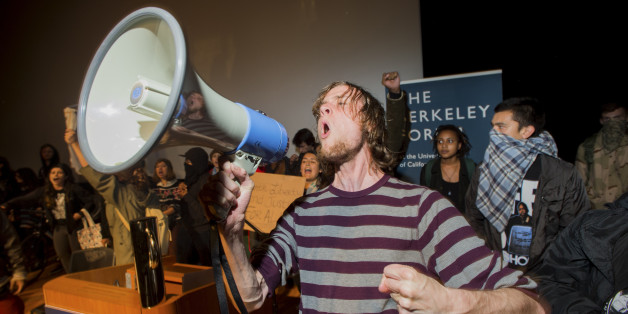 Protesters rallying against police violence storm a lecture with PayPal co-founder Peter Thiel at the University of California at Berkeley campus in Berkeley, California December 10, 2014. More than 100 people marched peacefully for several hours before some began breaking windows, looting a cell phone store and spray painting graffiti. REUTERS/Noah Berger (UNITED STATES - Tags: CIVIL UNREST EDUCATION)