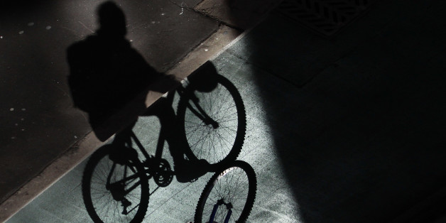 An worker pedals on a bike line in central Sydney August 27, 2012. Australia's top central banker said on Friday it was too soon to call an end to the country's once-in-a-century mining boom, intensifying debate over the outlook for the resource-rich economy as miners shelve expansion plans and takeover deals. Image rotated 180 degrees. REUTERS/Daniel Munoz (AUSTRALIA - Tags: BUSINESS)