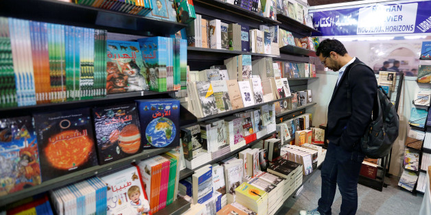 A man looks at books at the 33rd International Book Fair in Tunis, Tunisia March 24, 2017. REUTERS/Zoubeir Souissi