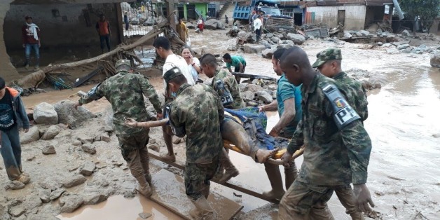 MOCOA, COLOMBIA - APRIL 01: (----EDITORIAL USE ONLY MANDATORY CREDIT - 'COLOMBIAN ARMY (EJERCITO NACIONAL) / HANDOUT' - NO MARKETING NO ADVERTISING CAMPAIGNS - DISTRIBUTED AS A SERVICE TO CLIENTS----) Colombian soldiers evacuate the victims of a deadly landslide that happened following heavy rains in Mocoa, Putumayo Colombia on April 01, 2017. At least 112 people dead and many others wounded and lost due to the landslide. (Photo by Colombian Army (Ejercito Nacional) / Handout/Anadolu Agency/Get