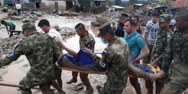 MOCOA, COLOMBIA - APRIL 01: (----EDITORIAL USE ONLY MANDATORY CREDIT - 'COLOMBIAN ARMED FORCES 6TH ARMY / HANDOUT' - NO MARKETING NO ADVERTISING CAMPAIGNS - DISTRIBUTED AS A SERVICE TO CLIENTS----) Colombian soldiers evacuate the victims of a deadly avalanche that happened following heavy rains in Macoa, Putumayo Colombia on April 01, 2017. At least 154 people lost their lives after three rivers in southern Colombia burst their banks early Saturday, creating an avalanche of mud and rocks th